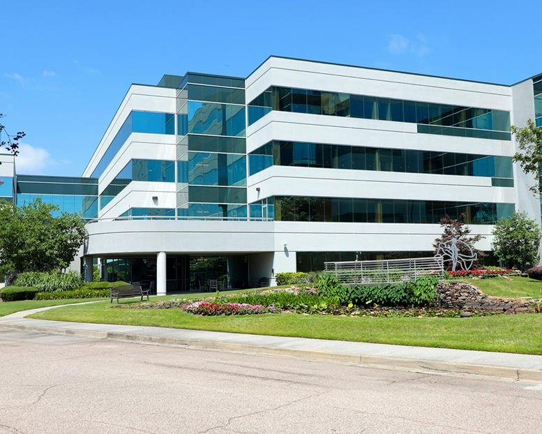 Exterior view of the modern glass and white facade at 1810 Pyramid Place, Nonconnah Business Park.
