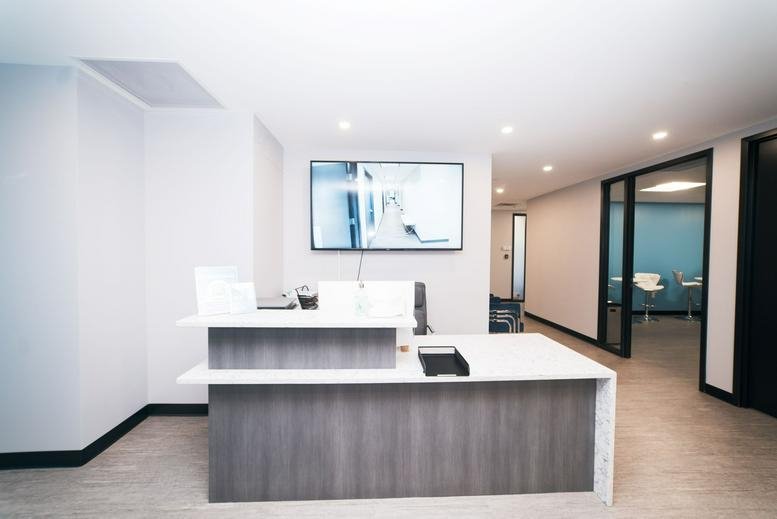 Bright modern reception area at 18310 Montgomery Village Avenue, Suite 300, Gaithersburg, Maryland.