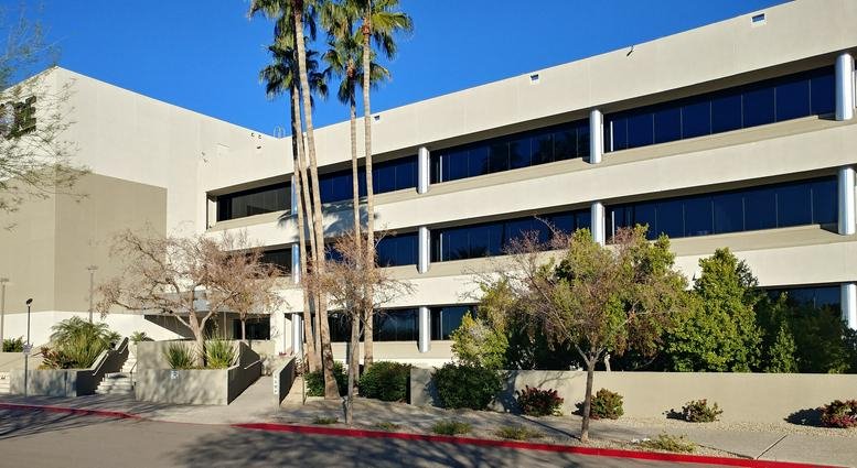 Exterior view of the multi-story office building at 18444 North 25th Avenue, Suite 420.