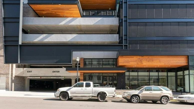 Modern architectural facade and street-level entrance of 18th & Chet, 818 18th Avenue South.