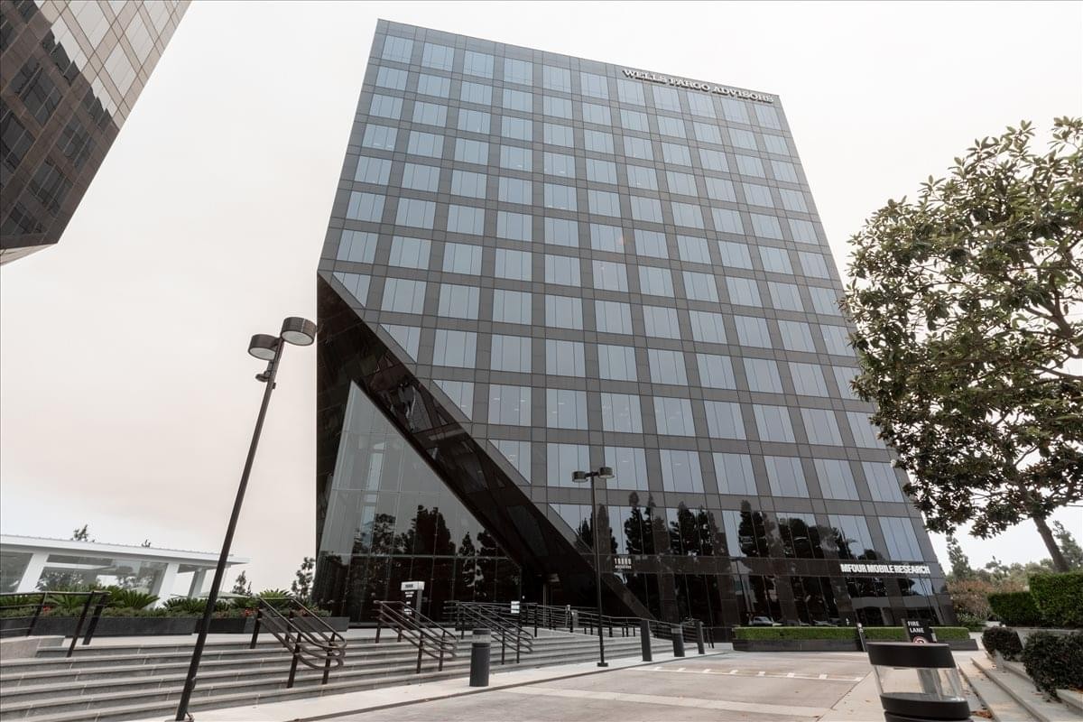 Exterior of the geometric glass facade building at 19800 MacArthur Boulevard.