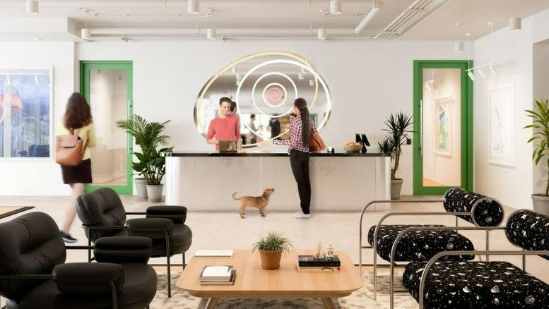 Modern reception desk at 200 Massachusetts Avenue Northwest, Washington DC featuring a circular wall feature and dog.
