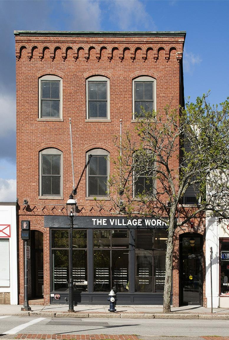 Exterior view of the red brick building facade at 202 Washington Street.