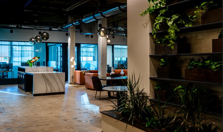 Spacious interior common area at 209, 10th Avenue South, Suite 560 featuring plants and lounge seating.