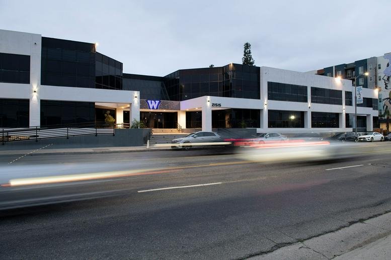 Exterior of the modern white and glass building at 21515 Vanowen Street.