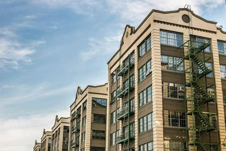 Exterior view of the industrial-style brick building at 220, 36th Street, Sunset Park, New York City.
