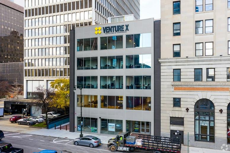 Exterior view of the modern Venture X building at 220 West Congress Street.