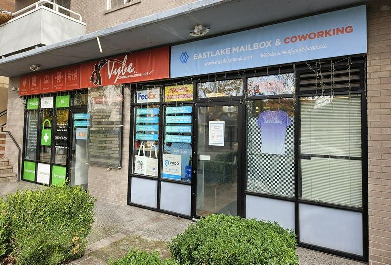 Exterior storefront of 2226 Eastlake Ave E showing Vybe and Eastlake Mailbox signage.