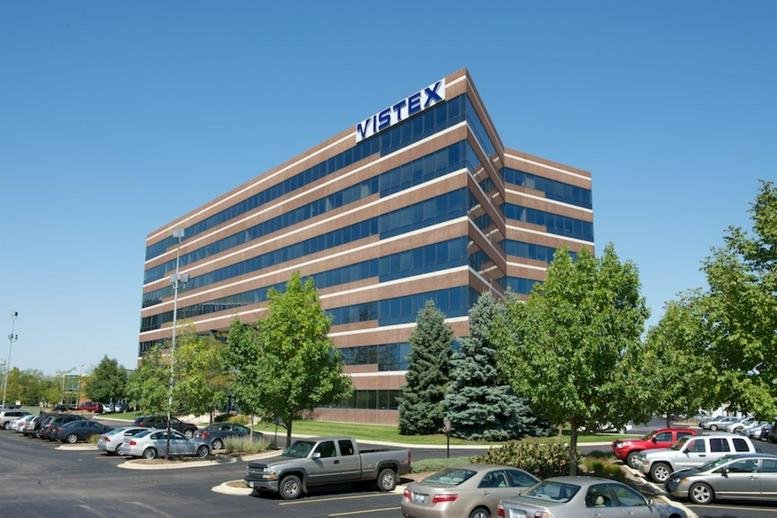 Exterior view of the brick and glass office building at 2300 Barrington Rd, Suite 400.