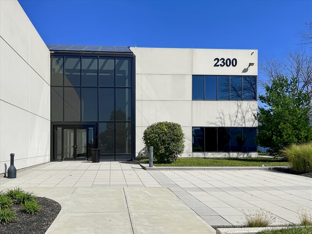 Exterior facade of the white and glass office building at 2300 Litton Lane, Suite 250, Hebron, Kentucky.