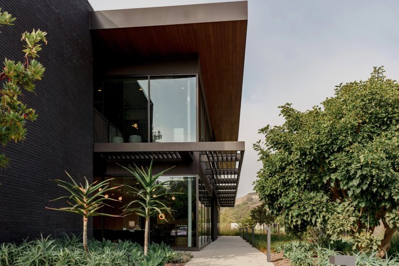 Exterior of the modern dark brick building at 23465 Civic Center Way.