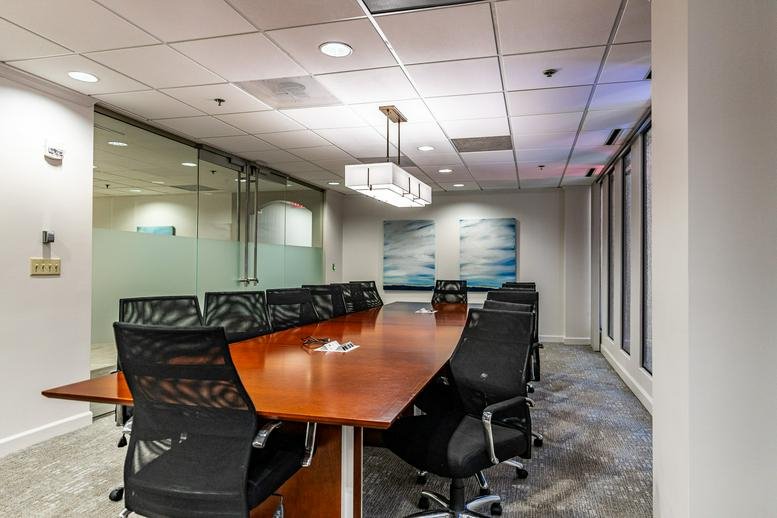 Professional conference room at 235 Peachtree Street, Suite 400 with a large wood table.