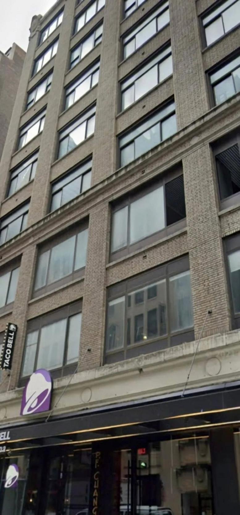 Exterior of the brick and glass New York Business Center, 240 West 40th Street facade.