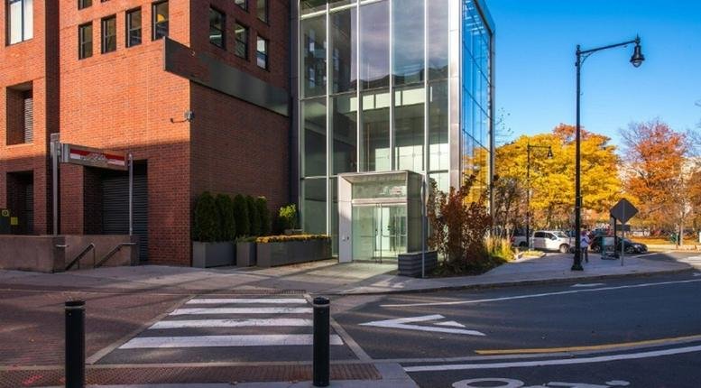 Exterior view of the brick and glass facade at 245 Main Street, Kendall Square, Cambridge, Massachusetts.