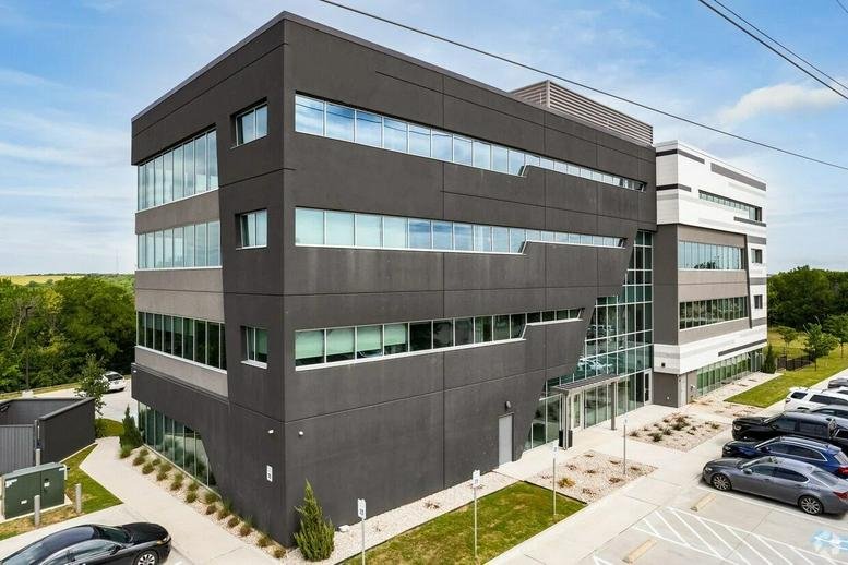 Modern exterior of the charcoal and white office building at 2451 W Grapevine Mills Circle.