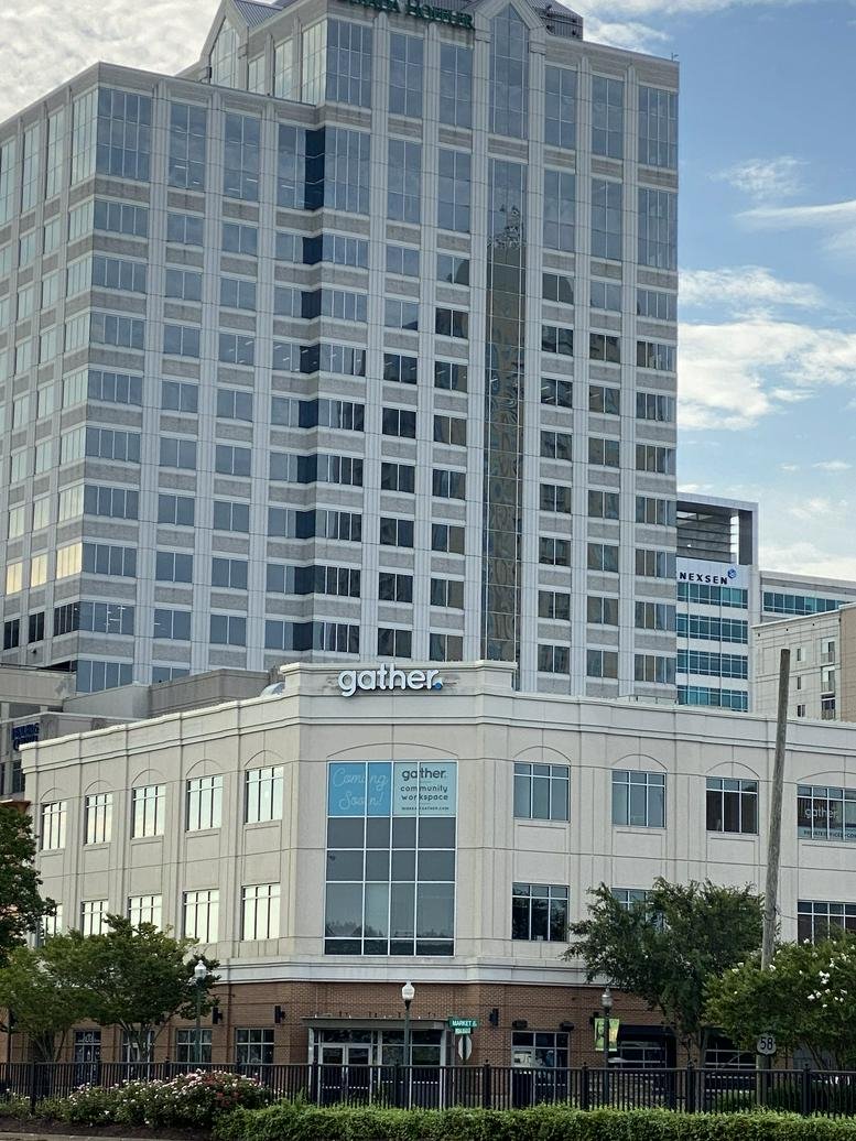 Exterior view of the white facade of the office building at 249 Central Park Avenue, Suite 300.