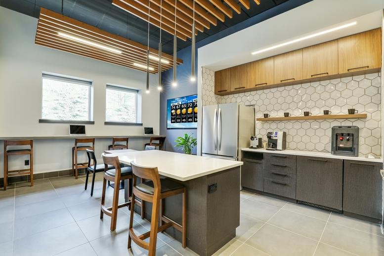 Wide-angle view of the communal kitchen at 25 Pompton Avenue, Suite 101, Montclair, New Jersey.