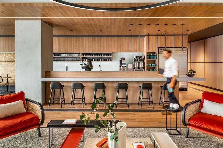 Spacious communal lounge and cafe area at 26 Wellington Street East, Suite 900.