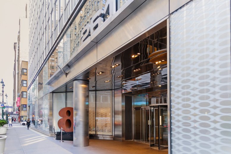 Exterior entrance of the polished 261 Madison Avenue building with its prominent number 8 sculpture.