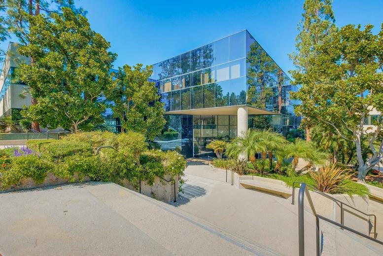 Exterior view of the glass-facade building at Corporate Point, 27001 Agoura Road.