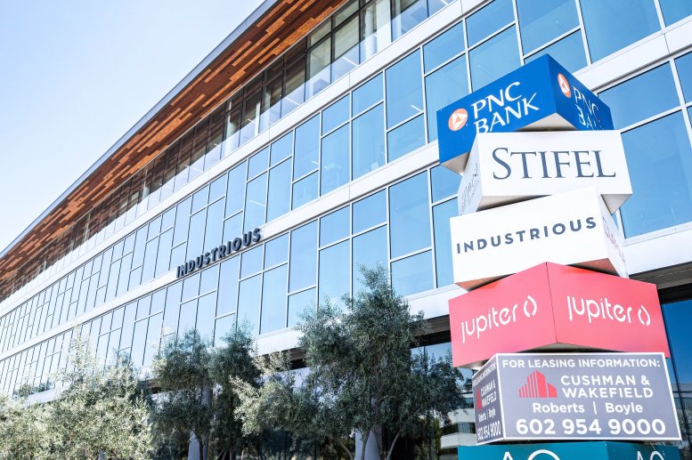Exterior view of the glass facade and tenant signage at 2801 E. Camelback Road, 2nd Floor, Biltmore.