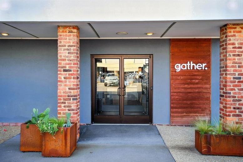 Exterior entrance of 2920 W Broad St, Richmond (Virginia) featuring brick pillars and gather signage.
