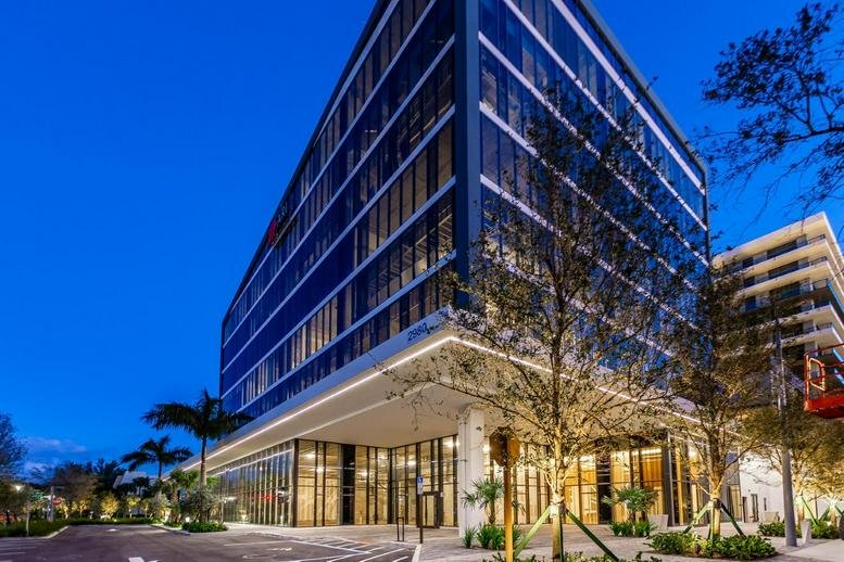 Exterior view of the modern glass facade at Aventura Park Square.