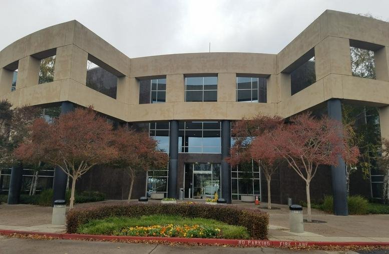 Exterior view of the professional office building at 2999 Douglas Boulevard, Suite 180.