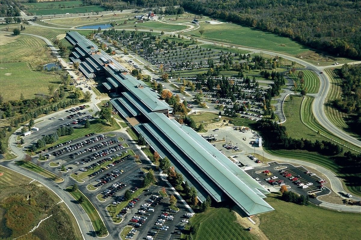 Aerial view of the sprawling green-roofed building complex at 30 Frank Lloyd Wright Drive.