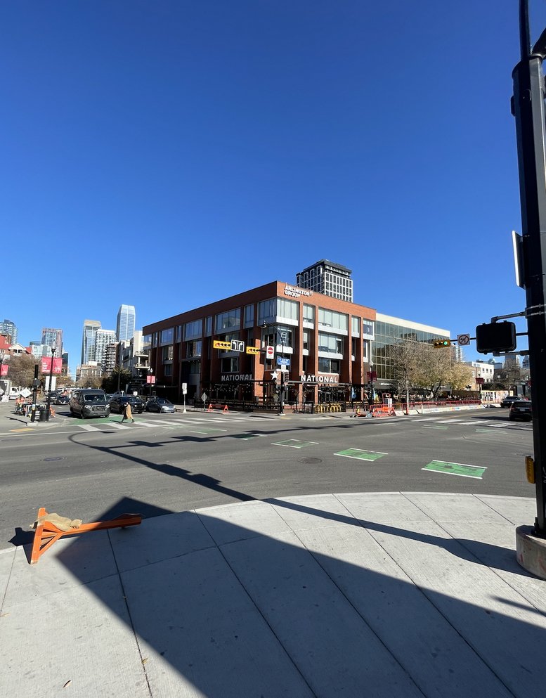 Street view of the multi-story brick and glass building at 300, 1550 5 St SW.