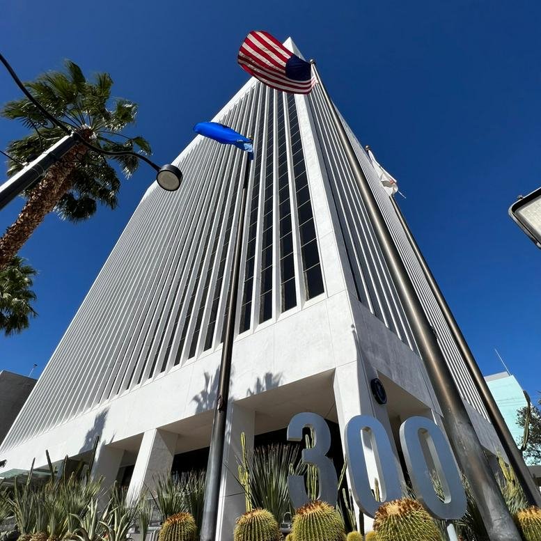 Exterior view of the white high-rise building at 300 South 4th Street, 6th Floor, Downtown.