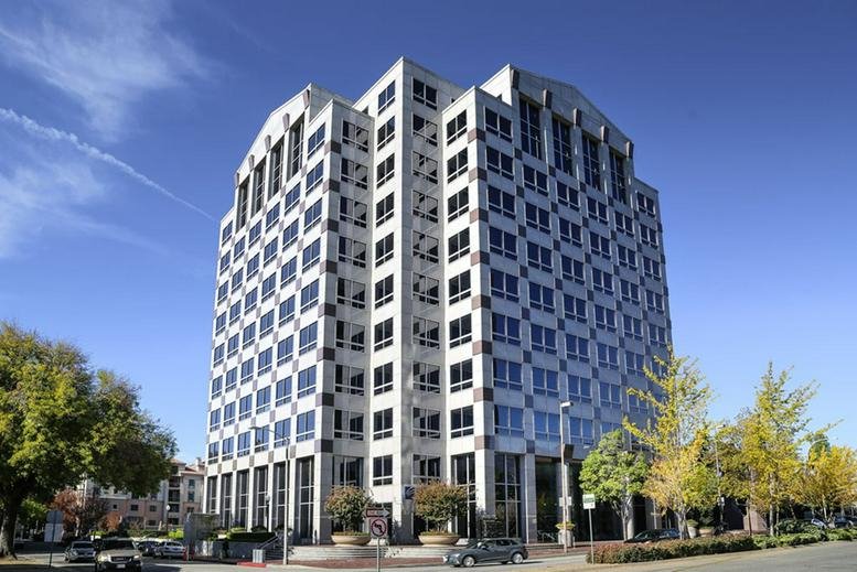 Exterior view of the white tiered building at 301 North Lake Avenue, Suite 600.