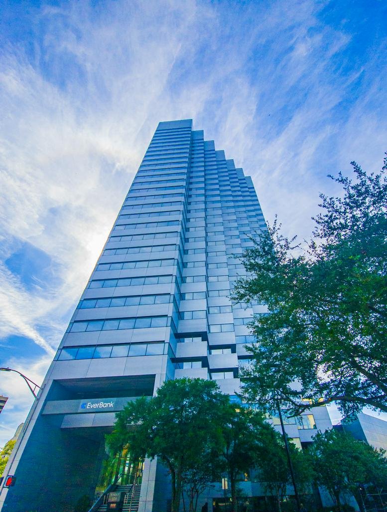 Exterior view of the tiered glass skyscraper at 301 W. Bay Street.