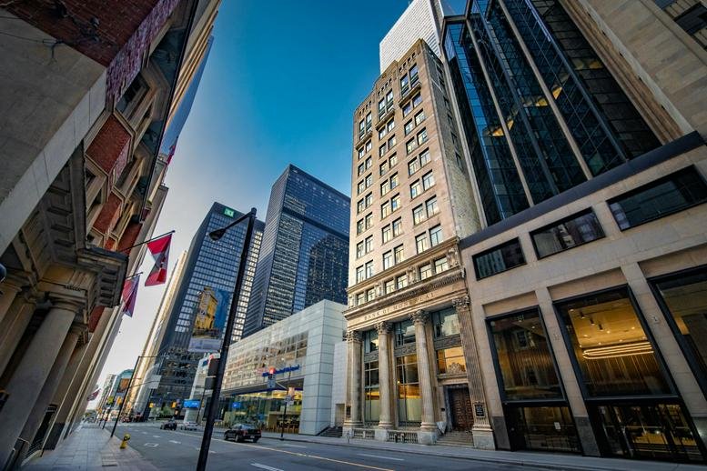 Exterior view of the historic stone and glass building at 302 Bay Street in the Financial District.