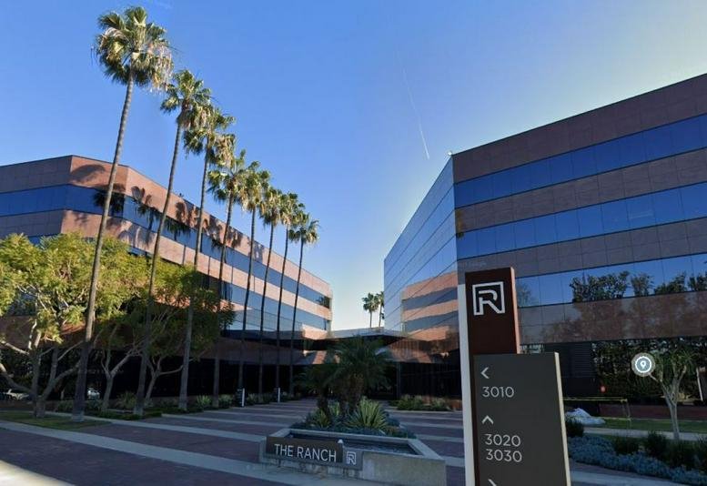 Exterior view of the professional glass and brick buildings at 3020 Old Ranch Parkway.