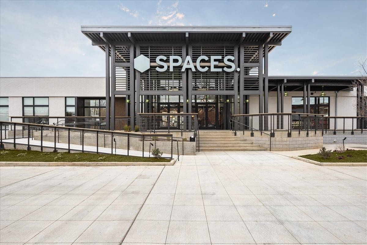 Modern exterior entrance of the Spaces building at 307 W Tremont Avenue, Suite 200, Charlotte.