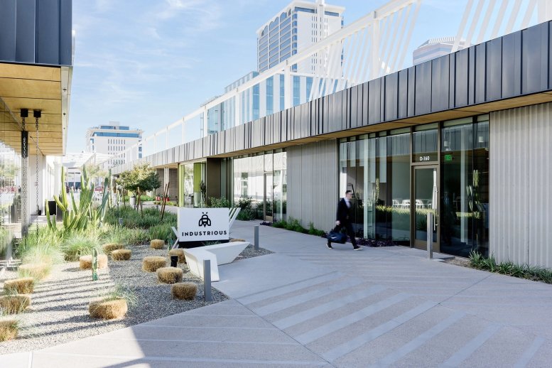 Exterior view of the modern glass-fronted entrance for Industrious at 3110 N Central Avenue, Phoenix, Arizona.