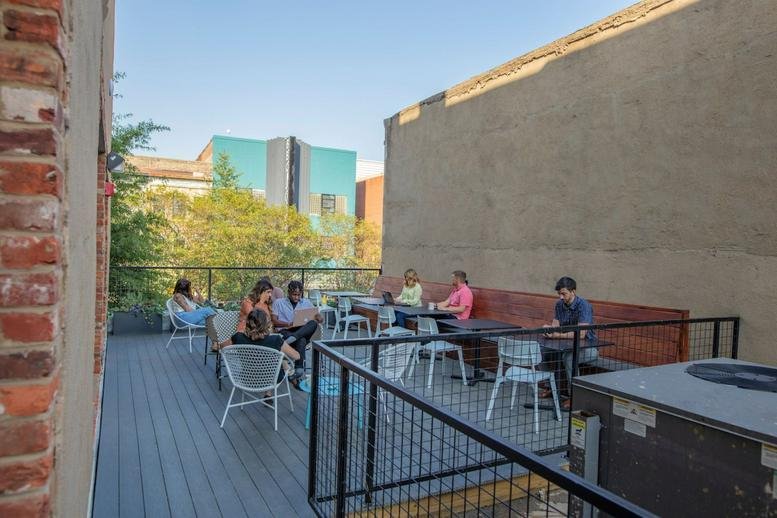 Outdoor rooftop terrace at 313 East Broad Street, Richmond (Virginia) featuring seating and city views.