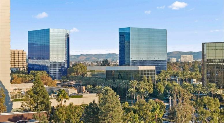Exterior view of the glass-facade towers at 3200 Park Center Drive.