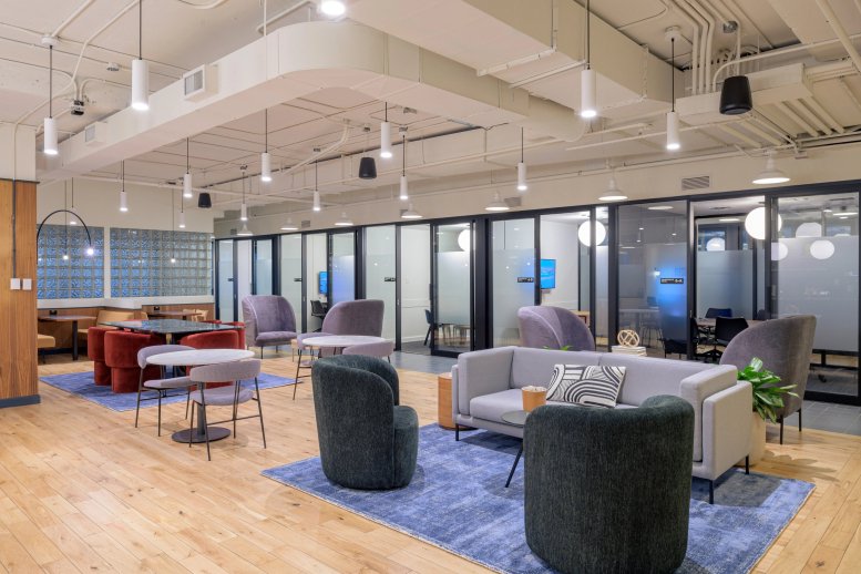 Spacious communal lounge at 33 Bloor Street East with varied seating and modern pendant lighting.