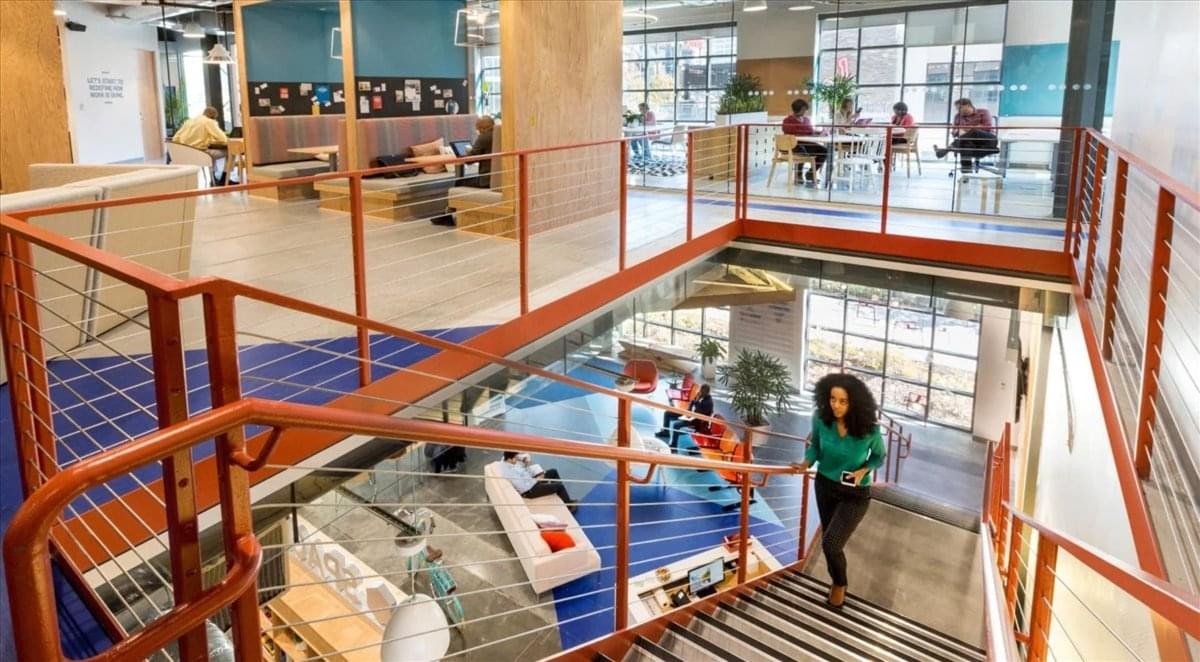 Multi-level communal area at 33 West Franklin Street, 2nd & 3rd Floor with stairs and lounge seating.