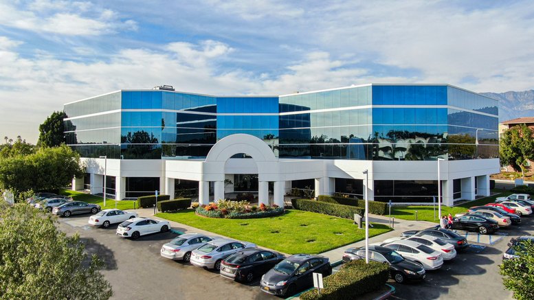Modern exterior view of the blue glass and white facade at 3350 Shelby St, Suite 200.