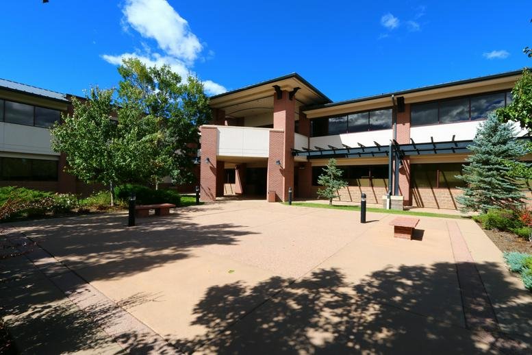 Exterior view of the brick and glass facade at 357 S. McCaslin Blvd, Suite 200, Louisville (Colorado).