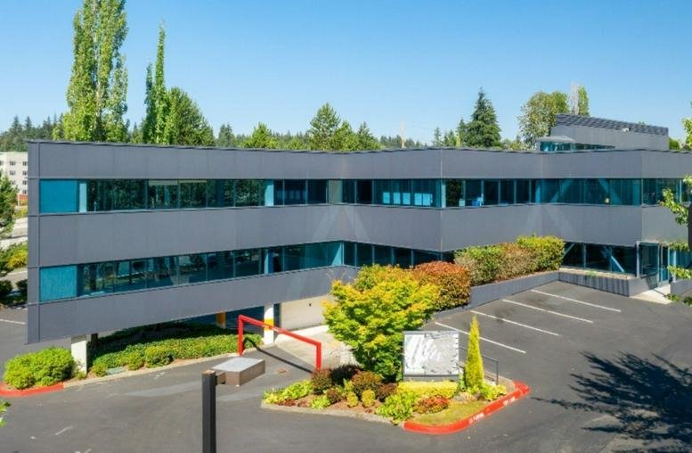 Exterior view of the multi-story glass and grey office building at 3600 136th Pl SE, 270.