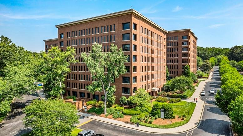 Exterior view of the brick facade at 3715 Northside Parkway, Building 100 Suite 500.
