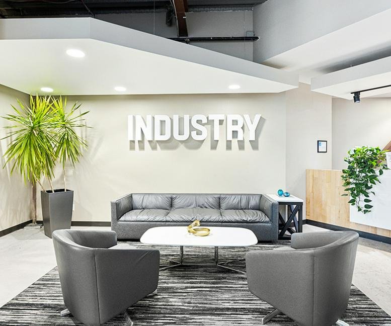 Exterior entrance view of the Industry building with prominent signage.