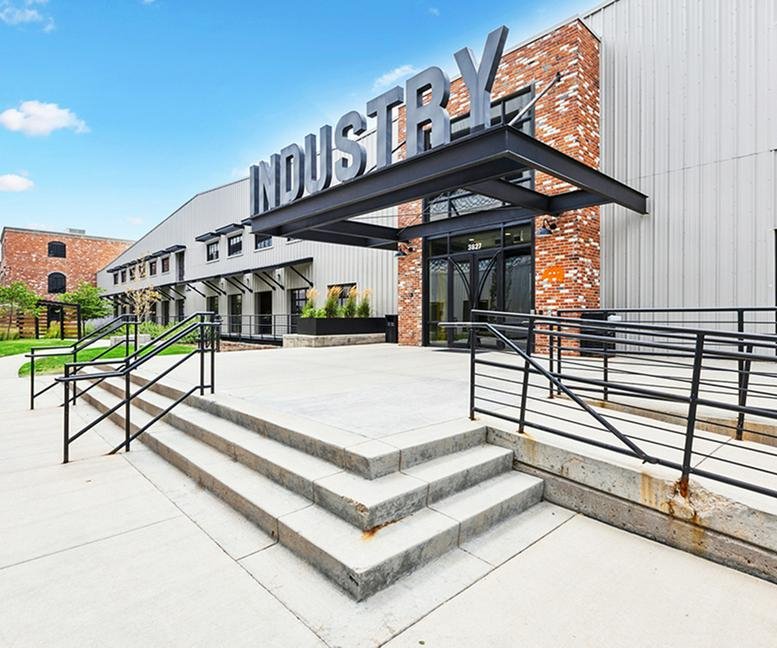 Exterior view of the industrial-style brick and metal building at 3827 Lafayette Street.