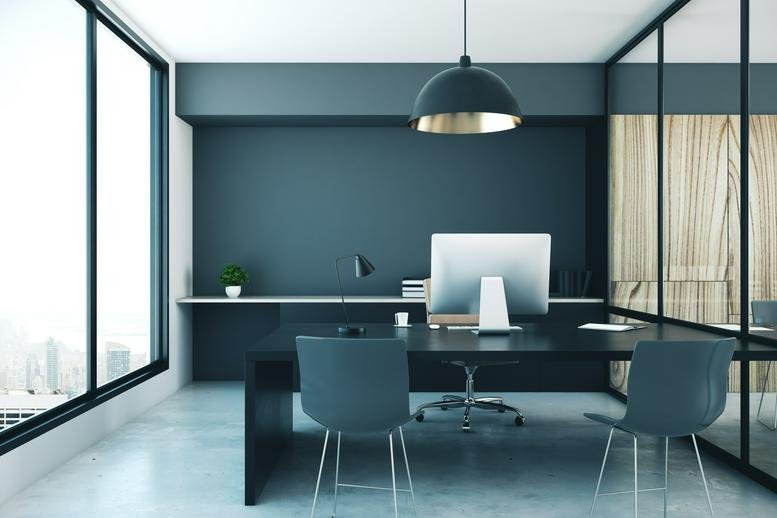 Modern private office suite at 3835 Gulfway Drive, Pioneer Park with dark walls and a large pendant light.