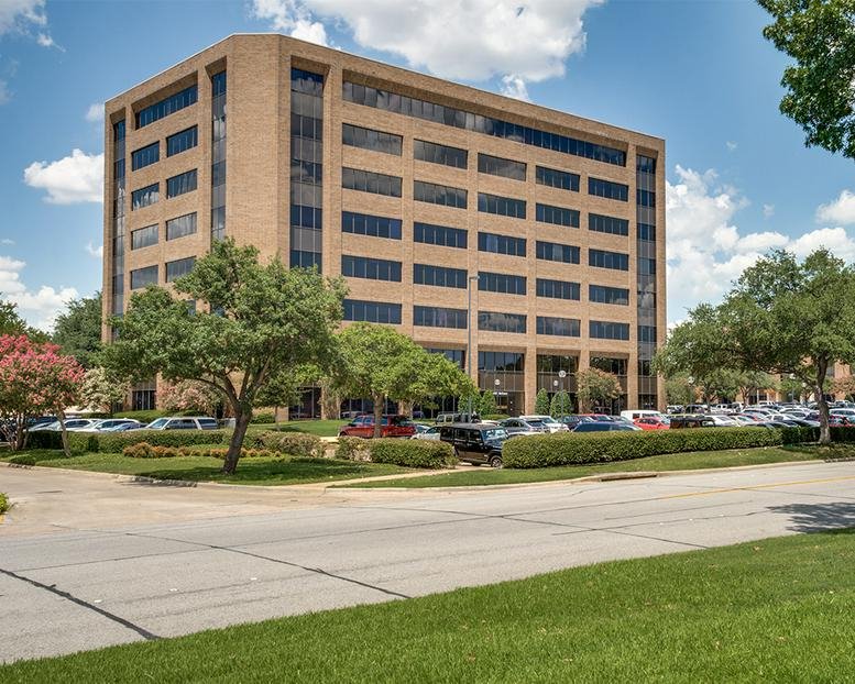 Exterior view of the brick-facade office building at 4101 McEwen Road.
