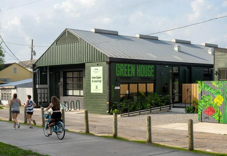 Exterior view of the Green House at 4157 St Louis Street with its distinctive green metal facade.